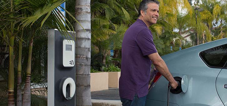 Man charging his electric vehicle