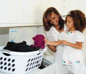 Mother and daughter doing the laundry