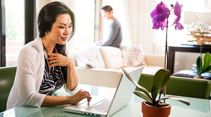 Woman looking at screen on laptop