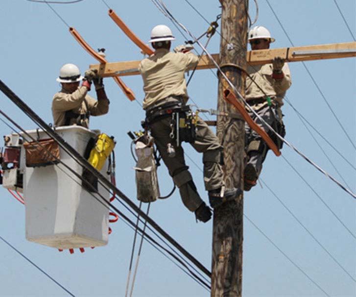 Linemen working on transmission line