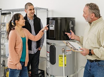 three people discussing heat pump water heater image