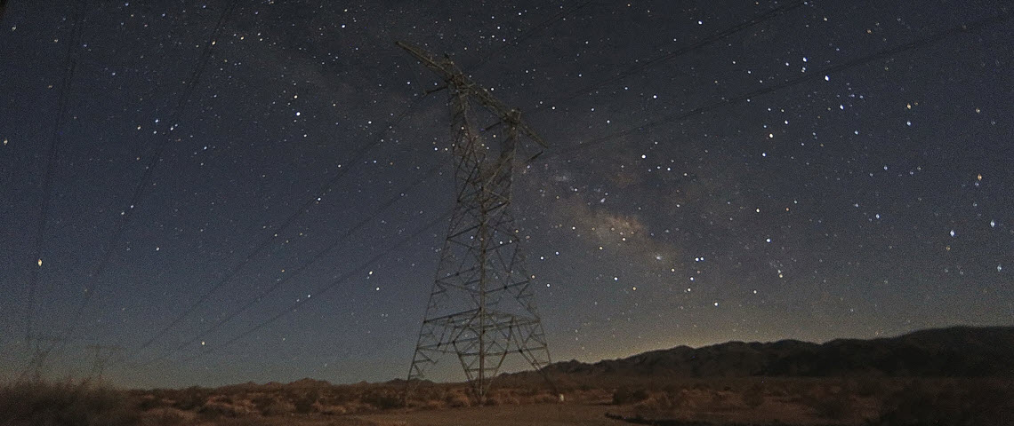 starry sky above powerlines