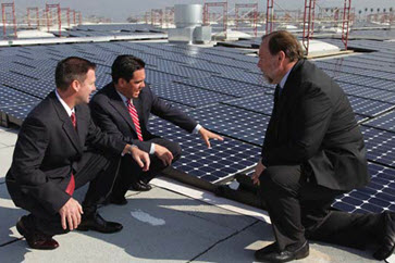 businessmen on rooftop and talking solar panels