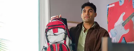 man holding a backpack